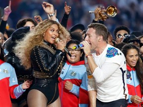Beyonce and Chris Martin of Coldplay perform during half-time at the NFL's Super Bowl 50 football game between the Carolina Panthers and the Denver Broncos in Santa Clara, California February 7, 2016.