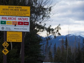 A sign showing an avalanche hazard warning of "considerable" is seen at a parking lot where snowmobilers embark from near Mount Renshaw outside of McBride, B.C., on Saturday January 30, 2016. Five snowmobilers died Friday in a major avalanche in the Renshaw area east of McBride.