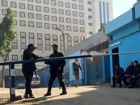 Policemen guard in front of a morgue where the body of an Italian Giulio Regeni is kept in Cairo, Egypt, February 4, 2016. The body of an Italian student who went missing in Cairo was found half naked by the roadside with cigarette burns and other signs of torture, a senior Egyptian prosecutor said on Thursday. REUTERS/Amr Abdallah Dalsh