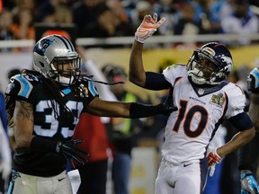 Carolina Panthers’ Tre Boston (33) is called for a penalty after pushing Denver Broncos’ Emmanuel Sanders (10) who was celebrating a catch during the second half of the NFL Super Bowl 50 football game Sunday, Feb. 7, 2016, in Santa Clara, Calif. (AP Photo/David J. Phillip)