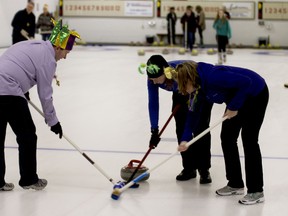 Steve Cripps, Melody Newman and Joann Newman (from left to right) sweep in front of the curling rock, guiding it toward the other end at the 16th annual Curl for Kids Sake, which was held at the Ingersoll Curling Club Saturday. (BRUCE CHESSELL, Sentinel-Review)