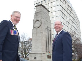 Casper Koevoets, past president of the Victory branch of the Royal Canadian Legion (left) and Mayor Matt Brown are happy that funding has been found to repair the cenotaph in London. (DEREK RUTTAN, The London Free Press)