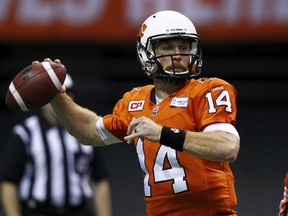B.C Lions quarterback Travis Lulay (14) throws against the Calgary Stampeders during their CFL game in Vancouver November 7, 2015. (REUTERS/Ben Nelms)