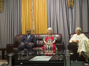 Freed hostage Jocelyn Elliott, who was kidnapped with her husband in Burkina Faso by al Qaeda, sits with Burkina Faso Foreign Minister Alpha Barry and Niger Foreign Minister Aichatou Kane Boulama at the presidential palace in Ouagadougou, Burkina Faso, February 8, 2016. (REUTERS/Nabila El Hadad)
