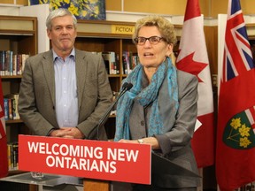 Premier Kathleen Wynne speaks to reporters following a visit with immigrant civics students at a Toronto adult learning school on Monday, February 8 2016. (Toronto Sun/Antonella Artuso)