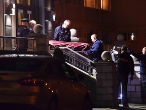 Police remove a body from the scene of a shooting at the Regency Hotel in Dublin, Ireland in this February 5, 2016 file photo. (REUTERS/Clodagh Kilcoyne/Files)