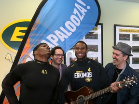 Eskimos DE Odell Willis, left, and receiver Adarius Bowman, second from right, joke around with members of local country band Hey Romeo on Monday during a media preview of Porkapalooza, a three-day festival in June to launch the team's 2016 season. (Tom Braid)