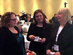 Alberta Health Minister Sarah Hoffman, left, speaks with associate health minister Brandy Payne and Alberta Health Services board chair Linda Hughes on Monday, Feb. 8, 2016, at the Westin Hotel during a conference on physician pay.  (Keith Gerein)