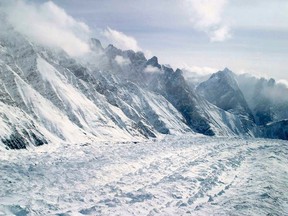 This Feb. 1, 2005 file photo shows an aerial view of the Siachen Glacier, which traverses the Himalayan region dividing India and Pakistan, about 750 km (469 miles) northwest of Jammu, India. An avalanche hit the Siachen Glacier in the Indian-controlled portion of Kashmir early Feb. 3, 2016. An Indian soldier who was found alive under 25 feet (8 metres) of snow, six days after he was buried by the avalanche, died in hospital on Thursday. (AP Photo/Channi Anand, File)