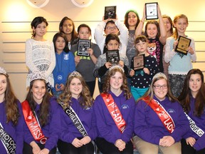 Some of the contestants at the Second Annual Cochrane Public Library Karoake Contest show off their prizes with members of the Princess Pageant participants.