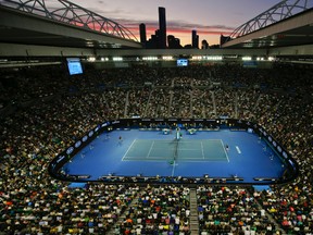 The sun sets over Rod Laver Arena during the men's singles final between Novak Djokovic of Serbia and Andy Murray of Britain at the Australian Open tennis championships in Melbourne, Australia, Sunday, Jan. 31, 2016.(AP Photo/Vincent Thian)