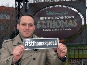 St. Thomas Economic Development Corporation general manager Sean Dyke displays a #stthomasproud bumper sticker at the campaign launch last spring.