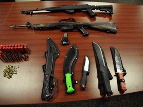 London police seized two automatic rifles, five knives and ammunition from a Gramercy Park Place home Tuesday. (Police supplied photo)