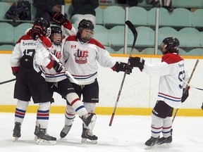 Members of the Wallaceburg minor midget hockey team celebrate after scoring their first goal against Ingersoll on Sunday at Wallaceburg Memorial Arena. Wallaceburg scored three goals in the third period to win 4-2 and even their OMHA playdown quarterfinal series at two points each. The two teams continue play Feb. 9 in Ingersoll and then again Feb. 11 at Walpole Island Sports Complex at 7:30 p.m.