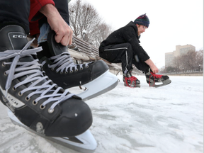 he Rideau Canal opened again to skaters in Ottawa Tuesday Feb 9, 2016. Roger Sandwick and his son Isaac came all the way from Westport New York to skate on the Canal and to take in  Ottawa Senators game. (Tony Caldwell/Postmedia)