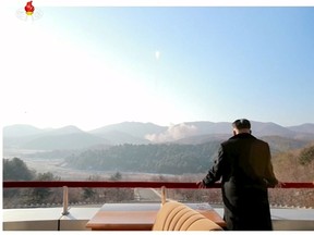 North Korean leader Kim Jong Un watches a long range rocket launched into the air in this still image taken from KRT file footage and released by Yonhap on February 7, 2016. (REUTERS/Yonhap/Files)