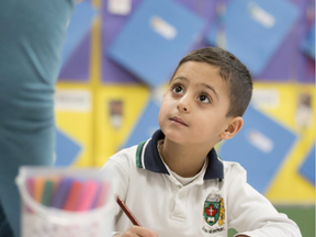 Gebran Maatouq, 5, listens to instructions during his first full day of school at École élémentaire catholique Montfort in Ottawa, January 14, 2016 (Jason Ransom/ Postmedia)