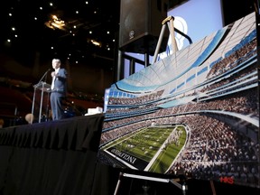 Los Angeles Rams Chief Operating Officer Kevin Demoff speaks behind an illustration of the Rams planned new stadium at a celebration to welcome NFL team, the Los Angeles Rams, at the Forum in Inglewood, Los Angeles, California, United States, January 15, 2016. The St. Louis Rams are moving to Los Angeles after National Football League owners voted to approve their relocation efforts on Tuesday and gave the San Diego Chargers the option to join them. The Rams' proposal to relocate to a planned $1.85 billion facility in Inglewood, roughly 10 miles from downtown Los Angeles, was approved by owners by a vote of 30-2 according to a report on the NFL's website. REUTERS/Lucy Nicholson