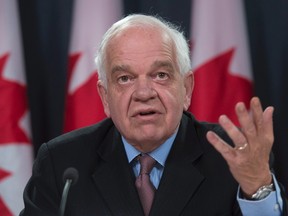 Immigration Minister John McCallum updates the media on the Syrian refugees arriving in Canada, during a news conference, Wednesday, February 3, 2016 in Ottawa. THE CANADIAN PRESS/Adrian Wyld