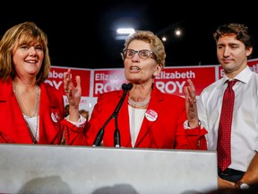 Prime Minister Justin Trudeau joins Premier Kathleen Wynne, centre, at a rally for Whitby-Oshawa Liberal byelection candidate Elizabeth Roy in Whitby Tuesday, February 9, 2016. (Dave Thomas/Toronto Sun)