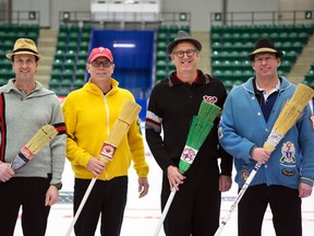 Team Hansen - Glenn Hansen, Doug McLennan, Don Bartlett and George Parson, dressed up in old-time sweaters and posing with archaic corn brooms - may be the old-times of the Boston Pizza Cup but they arrive in Camrose confident in their game. (Jessica Ryan)