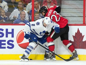 Toronto Maple Leafs defenceman Matt Hunwick (2) and Ottawa Senators forward Tobias Lindberg (23) battle for the puck at Canadian Tire Centre in September. (Marc DesRosiers/USA TODAY Sports)