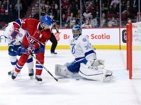 Canadiens forward Tomas Plekanec (14) scores a goal against Lightning goalie Ben Bishop during second period NHL action in Montreal on Tuesday, Feb. 9, 2016. (Eric Bolte/USA TODAY Sports)