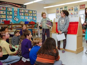 Spoken entirely in French, grades 6-7 students use photos, puppets and posters to teach other students at their school about the history of Mardi Gras. (Julia McKay/The Whig-Standard)