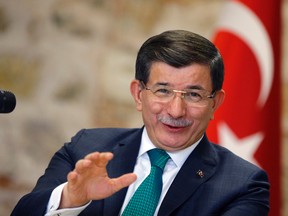Turkish Prime Minister Ahmet Davutoglu speaks to a group of foreign reporters in Istanbul, Turkey, Wednesday, Dec. 9, 2015.  (AP Photo/Emrah Gurel)