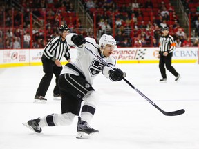 Los Angeles Kings defenceman Christian Ehrhoff (10) watches his shot against the Carolina Hurricanes at PNC Arena. (James Guillory/USA TODAY Sports)