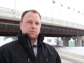 Det.-Const. Ryan Johnson, of the Greater Sudbury Police, stands near the Bridge of Nations where his quick actions may have saved a young woman's life in Sudbury, Ont. on February 8, 2016. John Lappa/Sudbury Star/Postmedia Network