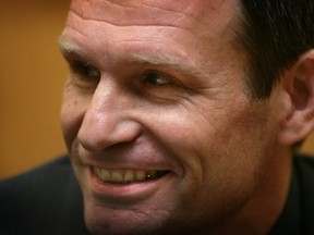 Armin Meiwes, who killed and ate a willing victim, smiles before the start of his second trial at Frankfurt's country court, January 12, 2006. Germany's Supreme Court ruled last April 2005, that the verdict was too lenient and Meiwes should face a second trial with a renewed murder charge.