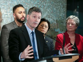 Councillor Glenn De Baeremaeker (L) and representatives from the taxi industry Wednesday, February 10, 2016 during a press conference at City Hall announcing they will not protest against Uber during the NBA All-Star Weekend. (Veronica Henri/Toronto Sun)