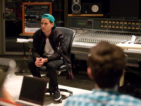 Ontario Institute of Audio Recording Technology graduate and YouTube sensation Mike Tompkins speaks about his career to a class at his former school in London Wednesday. (Craig Glover/The London Free Press)