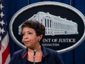 Attorney General Loretta Lynch pauses as she speaks during a news conference at the Justice Department in Washington, Wednesday, Feb. 10, 2016, about Ferguson, Missouri. (AP Photo/Carolyn Kaster)