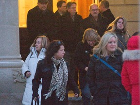 People most close to Noelle Paquette, including her mother Lynn in the white coat, father Roger (fourth man on the right wearing glasses) and sister Shauna Southcott (foreground, right )leave the Elgin County courthouse in St. Thomas, Ont. following a sentencing hearing for Noelle's killers on Wednesday February 10, 2016. Derek Ruttan/The London Free Press/Postmedia Network