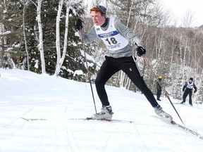 Adrian Marcolini of the the St. Benedict Bears  makes his way up the wall at Laurentian University  in Sudbury, Ont. on Wednesday February 10, 2016.  Marcolini raced to first place in the senior boys division during SDSSAA championships at Laurentian University. Gino Donato/Sudbury Star/Postmedia Network