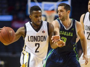 London Lightning's Nick Okorie pushes through Niagara's Sammy Zeglinski on the way to the basket during their Wednesday night NBL game at Budweiser Gardens (MIKE HENSEN, The London Free Press)