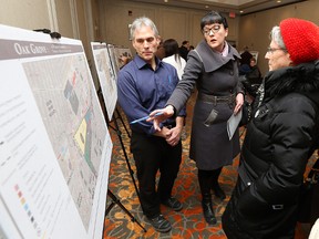 Project manager Geoff Zywina (left) speaks with the public about Oak Grove, a Gem Equities development to be build on the Parker lands, during an open house at the Holiday Inn Winnipeg South on Wed., Feb. 10, 2016. Kevin King/Winnipeg Sun/Postmedia Network