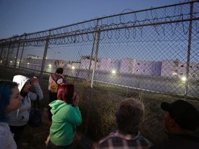 Inmates' relatives stand outside the Topo Chico prison in Monterrey, Mexico, February 11, 2016. Dozens of people were killed in a riot in a prison in northeastern Mexico early on Thursday, local media reported, the just days ahead of a planned visit by Pope Francis to another prison near in Mexico's far north. REUTERS/Daniel Becerril