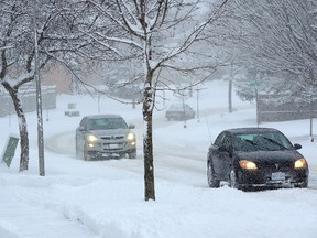 Early morning traffic drives on snow covered Sunnyside Dr. in north London during a snowstorm in London on Wednesday Feb 11, 2016 (MORRIS LAMONT, The London Free Press)