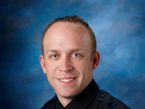 This undated photo released by Fargo Police Department shows Fargo police officer Jason Moszer. Moszer was shot amid a standoff in Fargo, N.D. with a domestic violence suspect, police in North Dakota said early Thursday. Moszer, 33, responded to the standoff Wednesday night and parked near the home the suspect was barricaded inside, Fargo Deputy Police Chief Joe Anderson said. (Fargo Police Department via AP)