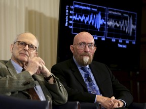 Dr. Rainer Weiss, emeritus professor of physics at MIT, (L) and Dr. Kip Thorne of Caltech (R) listen during a news conference to discuss the detection of gravitational waves, ripples in space and time hypothesized by physicist Albert Einstein a century ago, in Washington February 11, 2016. The waves were detected by twin Laser Interferometer Gravitational-wave detectors (LIGO) in Louisiana and Washington states in September 2015.    REUTERS/Gary Cameron