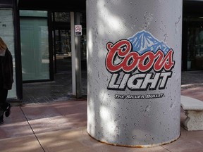 A post painted to look like a Coors Light beer can is seen outside of the MillerCoors U.S. corporate offices in Golden, Colorado February 12, 2014. The Canadian MolsonCoors headquarters are based in Montreal. REUTERS/Rick Wilking