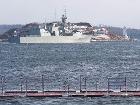 HMCS Fredericton heads past Georges Island as it sails from Halifax on Tuesday, Jan. 5, 2016. (THE CANADIAN PRESS/Andrew Vaughan)