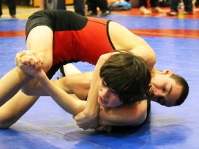 James Crummer of Lambton Central gains top position over St. Clair's Kevin Robertson during a 47.5-kg boy's wrestling match at the LKSSAA championships at SCITS on Thursday February 11, 2016 in Sarnia, Ont. The top four wrestlers in each of the 28 weight classes will advance to SWOSSAA next Thursday at St. Pat's. (Terry Bridge/Sarnia Observer/Postmedia Network)
