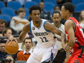 Minnesota Timberwolves guard Andrew Wiggins (22) looks to pass the ball around Toronto Raptors guard DeMar DeRozan (10) on the first half at Target Center. Jesse Johnson-USA TODAY Sports