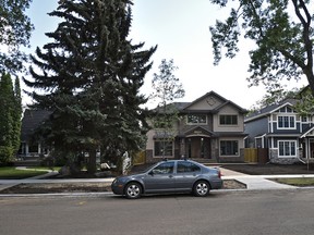 The Old Glenora Conservation Association is looking at ways to preserve old trees from being chopped down when infill housing, like these two homes on the right, is being built in mature areas like Old Glenora in Edmonton, August 18, 2015. ED KAISER/POSTMEDIA NETWORK
