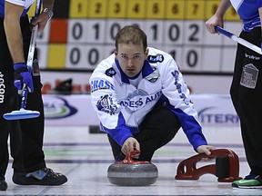 Skip Reid Carruthers delivers a rock during the 2016 Manitoba men's curling championship in Selkirk on Thu., Feb. 11, 2106. Kevin King/Winnipeg Sun/Postmedia Network