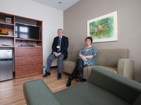 St. Joseph's Hospice CEO John Callaghan and executive director Julie Johnston sit in the living room of one of the palliative care units at the Windermere Road end-of-life care facility in London. (CRAIG GLOVER, The London Free Press)